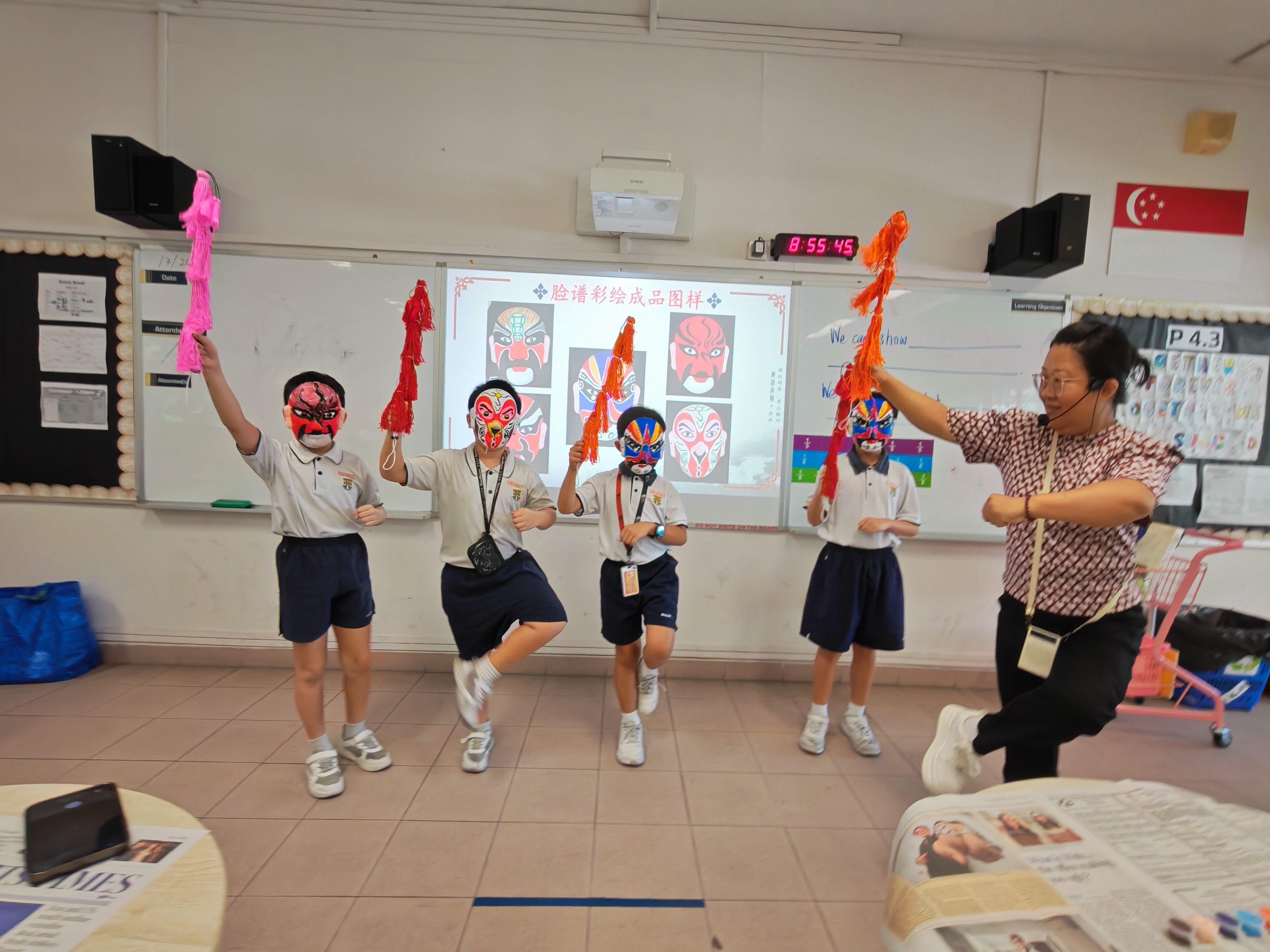 P4 CL Students trying out Chinese Opera